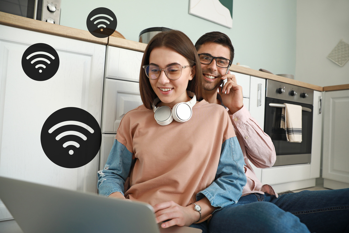 Young Couple Using Wifi at Home